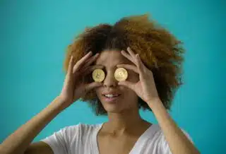 Woman Holding Two Coins