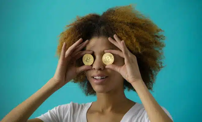 Woman Holding Two Coins